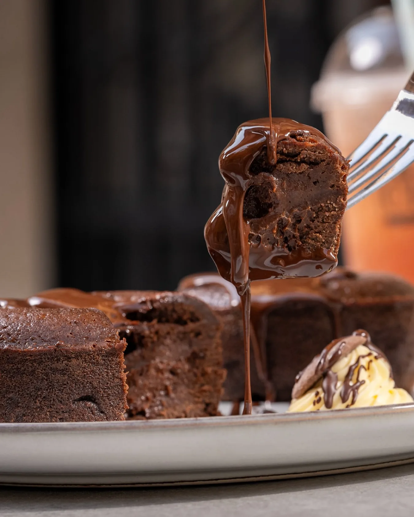 Melted chocolate dripping over a brownie