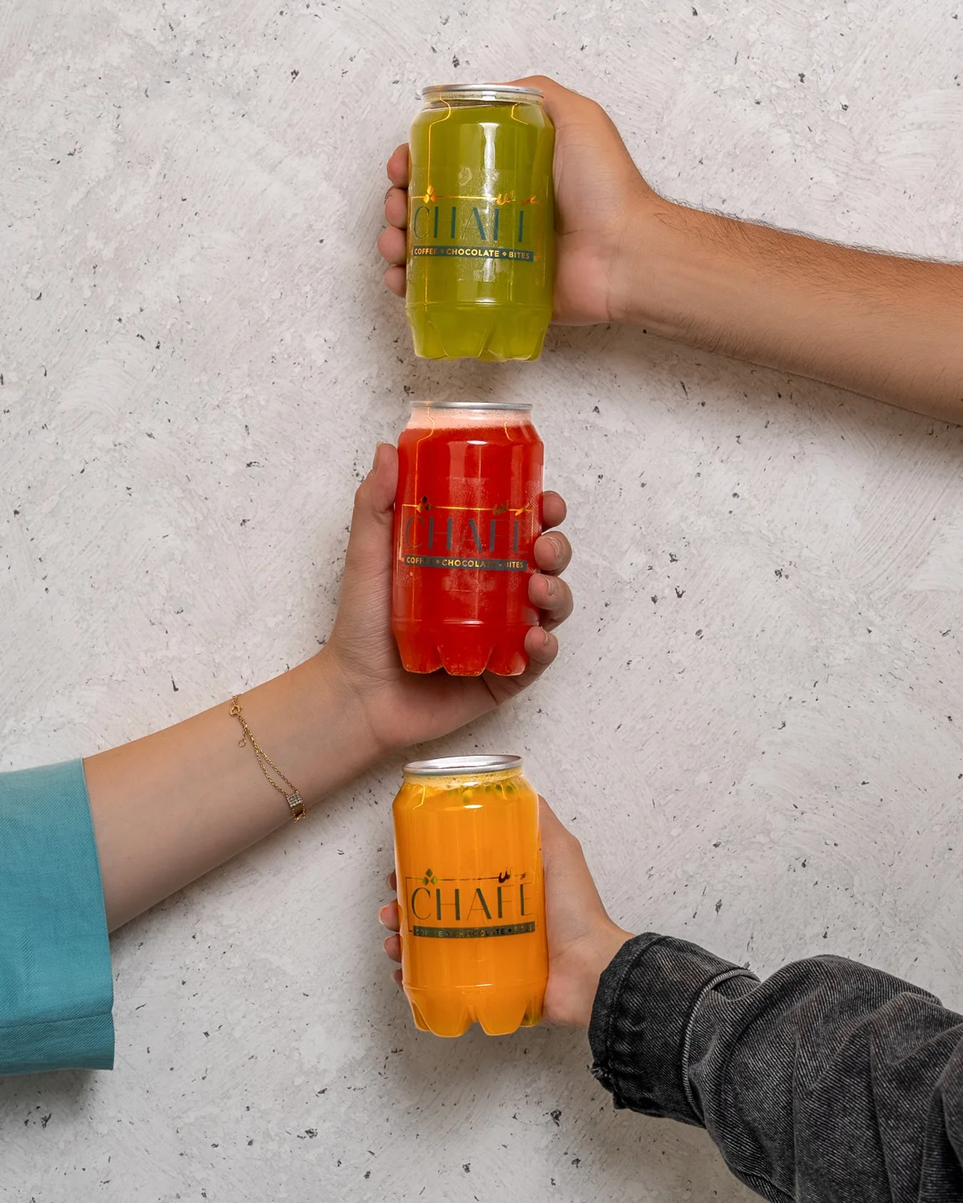 Three fresh juice cans passed hand to hand