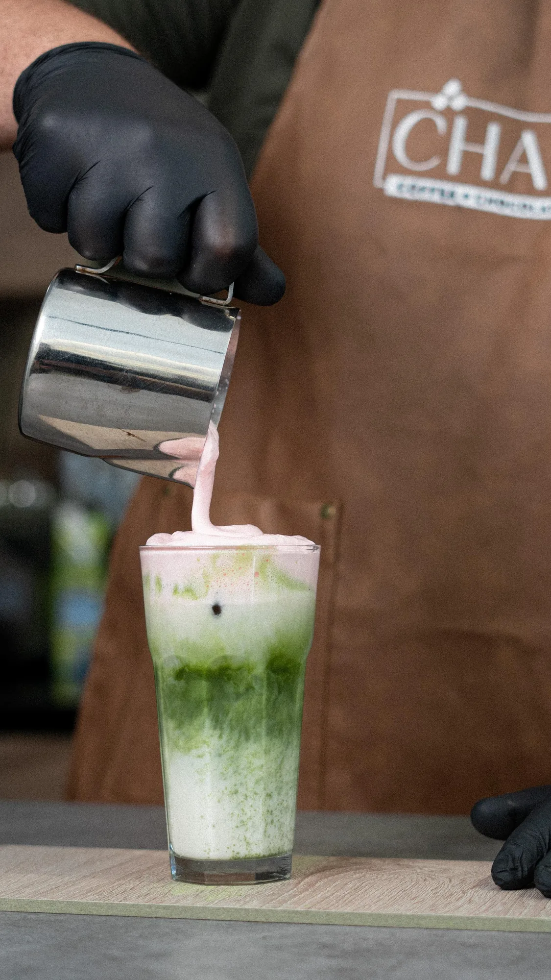 Strawberry matcha being poured