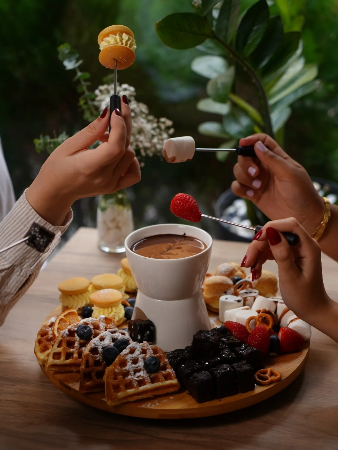 Friends sharing the Chafé Fondue Board