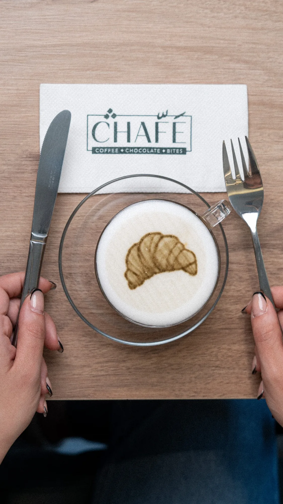 A croissant printed on a latte, on CHAFÉ paper